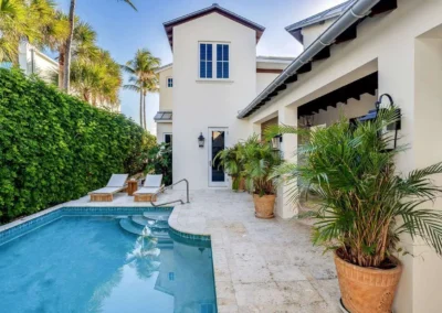 Luxury backyard pool with professional HDR editing, highlighting vibrant outdoor lighting.